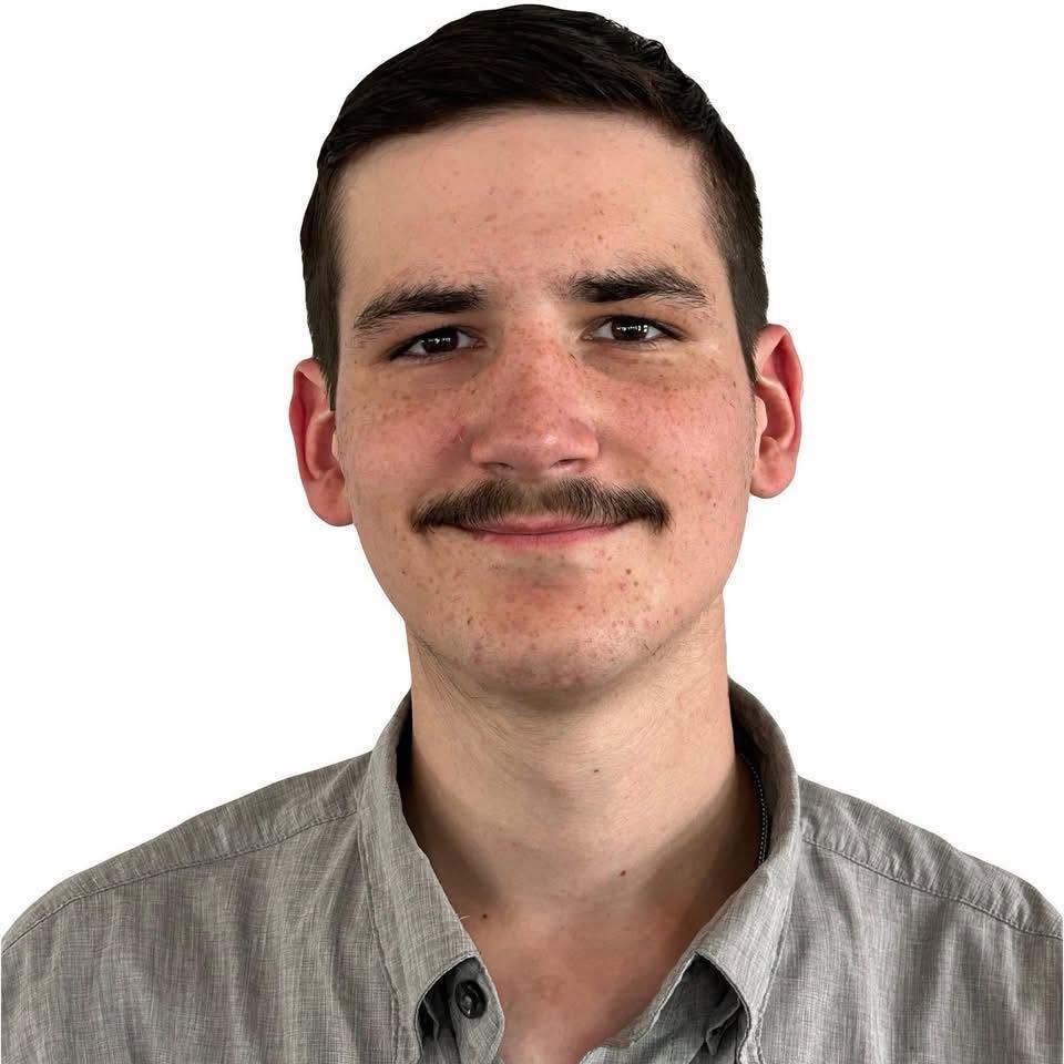 Professional headshot of Avery Buster.
